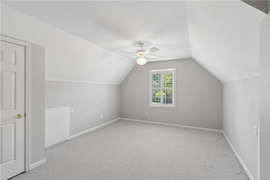 520 Redding View Court Northwest Sandy Springs, GA 30328 - Photo 19 of 27 an empty room with a window and a fan