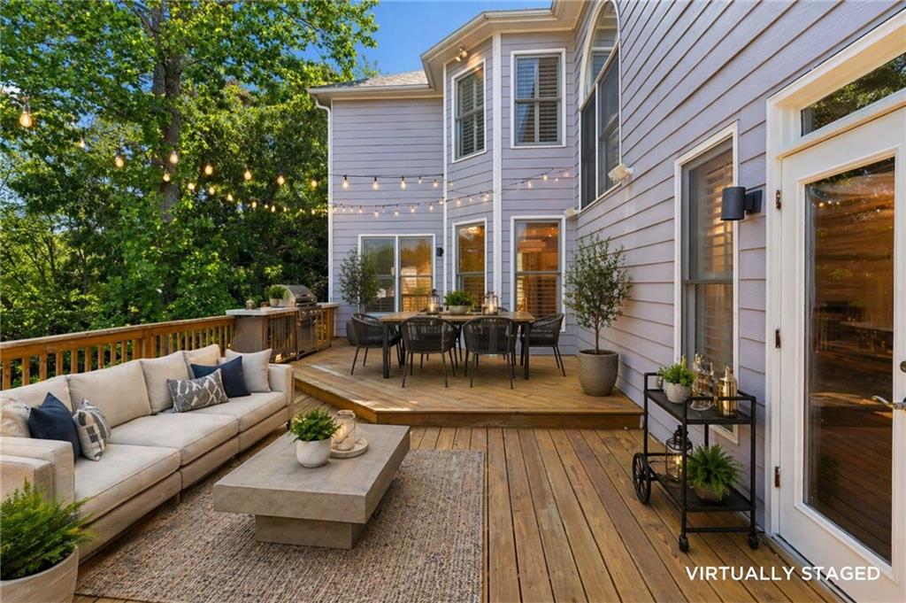 520 Redding View Court Northwest Sandy Springs, GA 30328 - Photo 23 of 27 a view of a patio with couches and a potted plant on a table