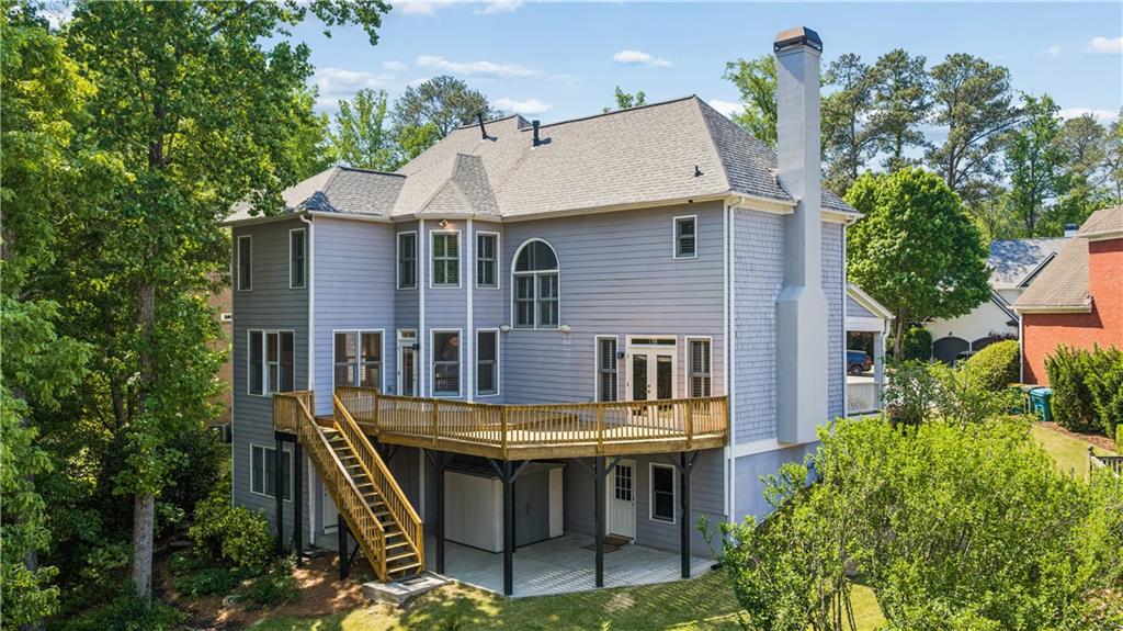 520 Redding View Court Northwest Sandy Springs, GA 30328 - Photo 25 of 27 a view of house with roof deck and seating space