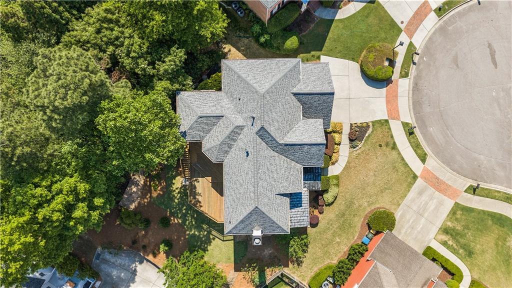 520 Redding View Court Northwest Sandy Springs, GA 30328 - Photo 26 of 27 an aerial view of a house with swimming pool and large trees