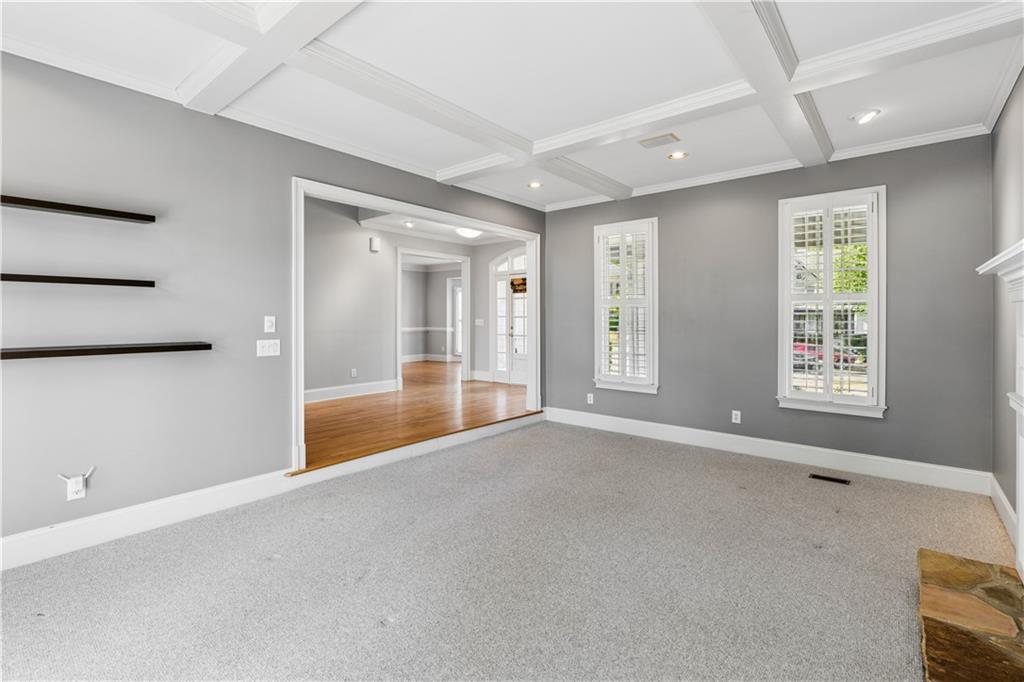520 Redding View Court Northwest Sandy Springs, GA 30328 - Photo 4 of 27 an empty room with windows and pillars in it