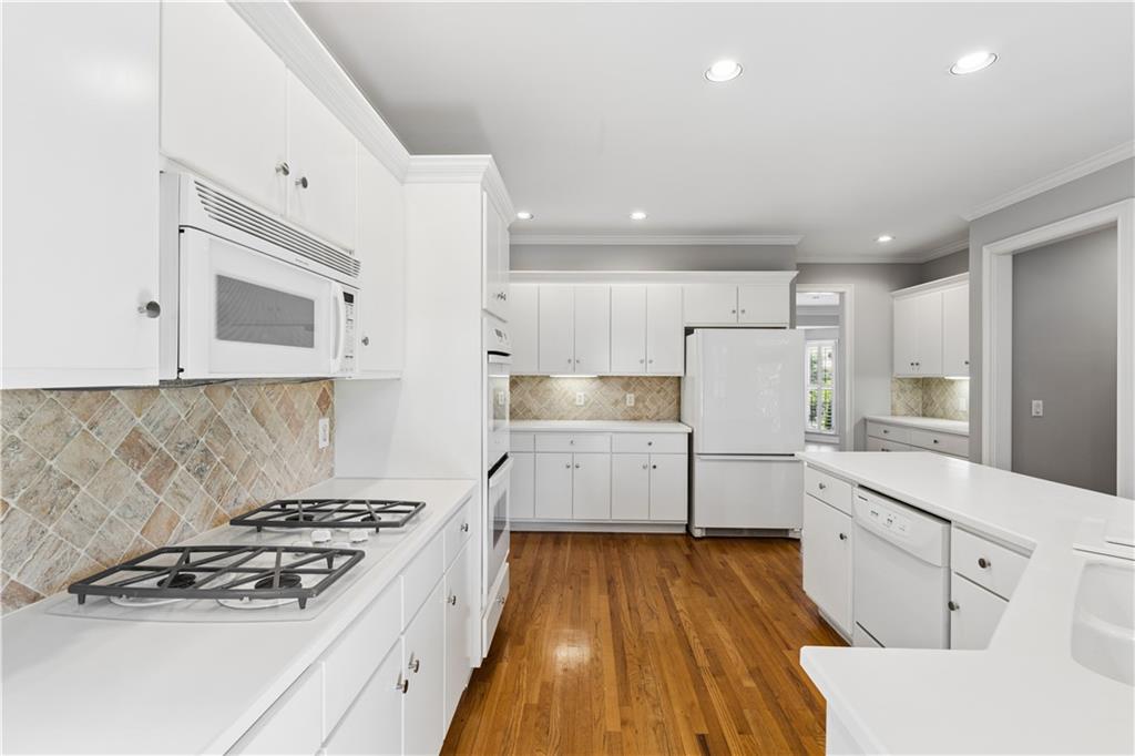 520 Redding View Court Northwest Sandy Springs, GA 30328 - Photo 7 of 27 a kitchen with white cabinets and white appliances