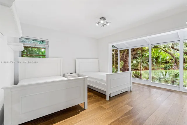 a bathroom with a double vanity sink and a large window