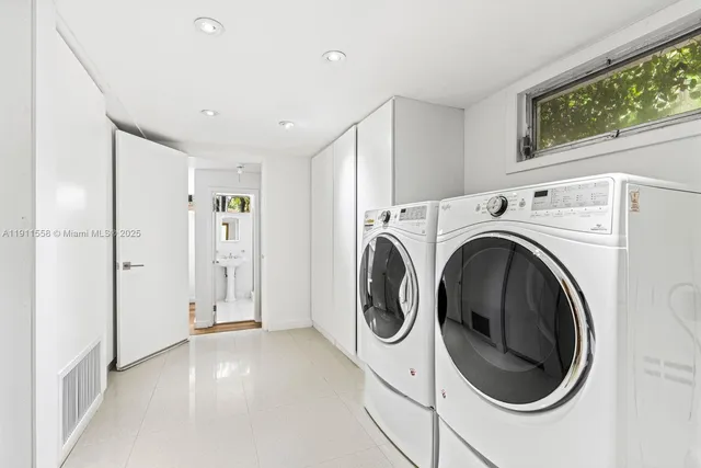 a view of a hallway with washer and dryer