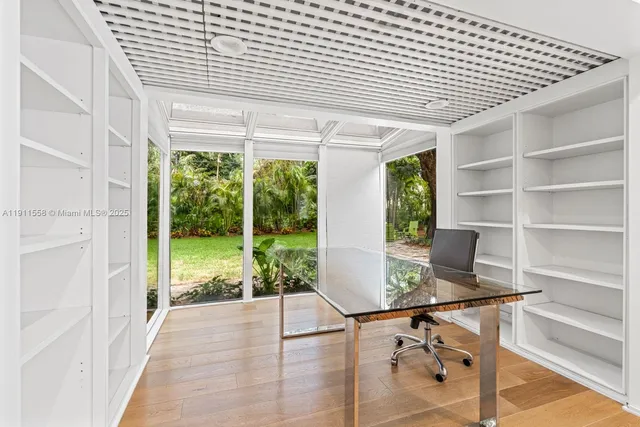 a workspace with furniture and a window