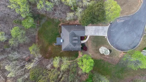 an aerial view of a house with outdoor space