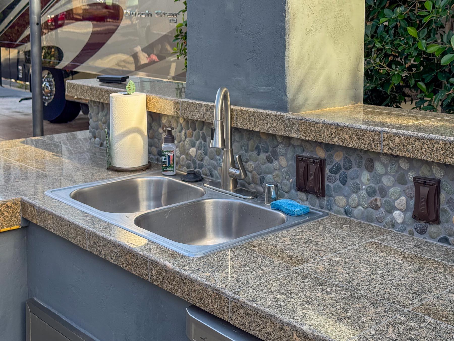 80394 Ave 48, Unit 36 Indio, CA 92201 - Photo 12 of 17 a kitchen with granite countertop a sink and a wooden floor