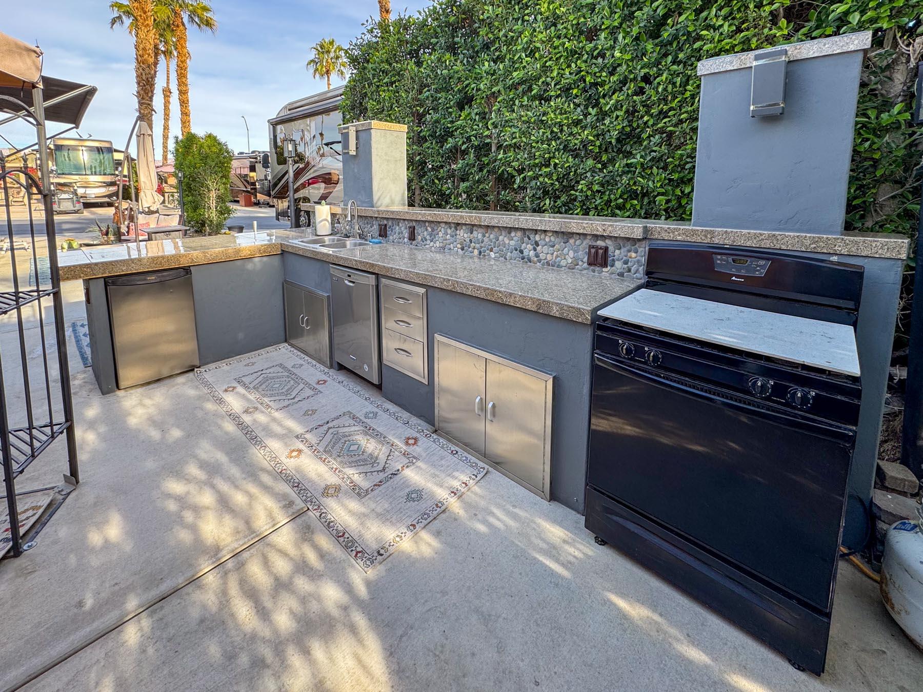 80394 Ave 48, Unit 36 Indio, CA 92201 - Photo 13 of 17 a kitchen with a stove and a microwave