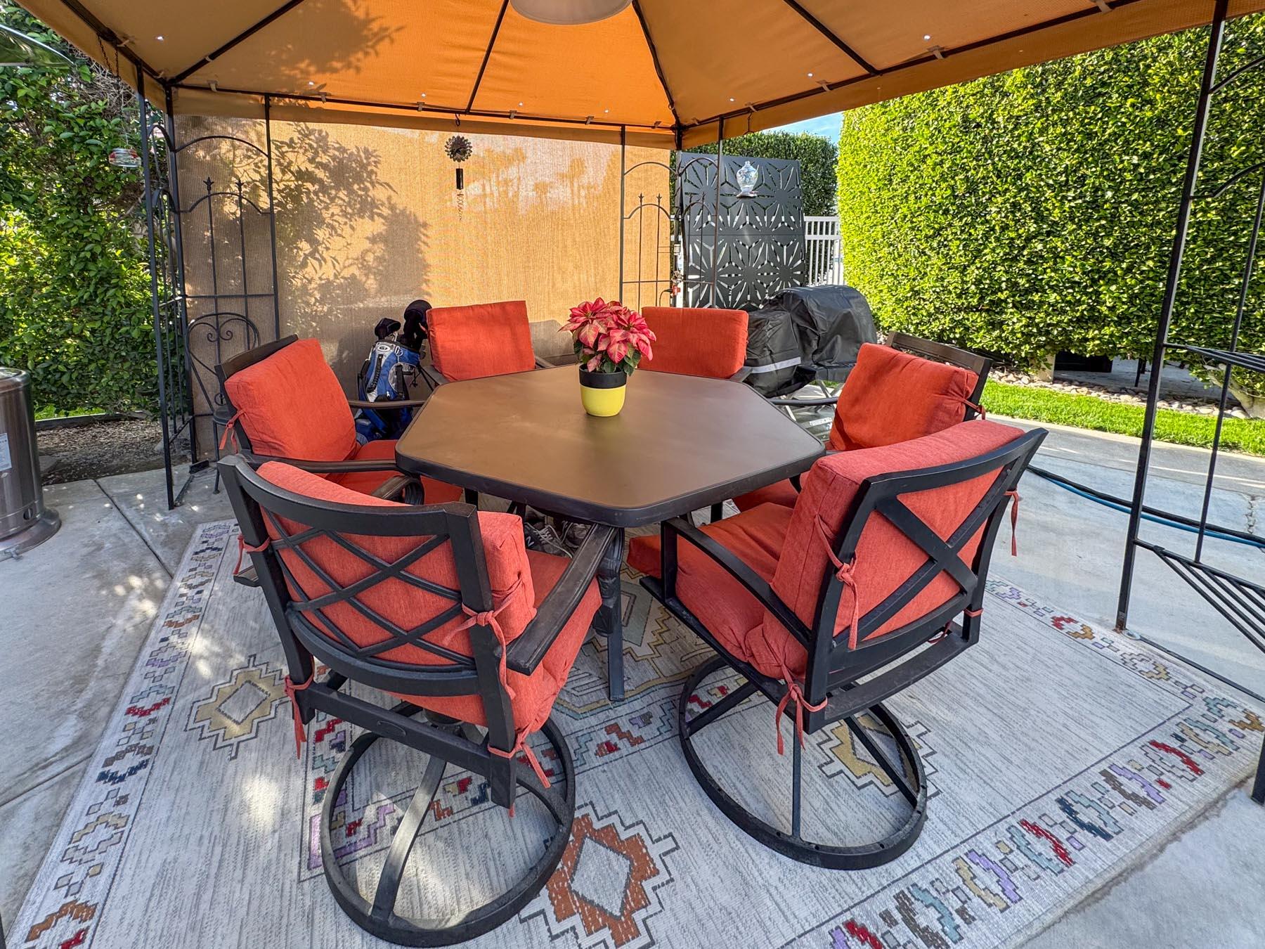 80394 Ave 48, Unit 36 Indio, CA 92201 - Photo 14 of 17 a view of a outdoor sitting area with furniture