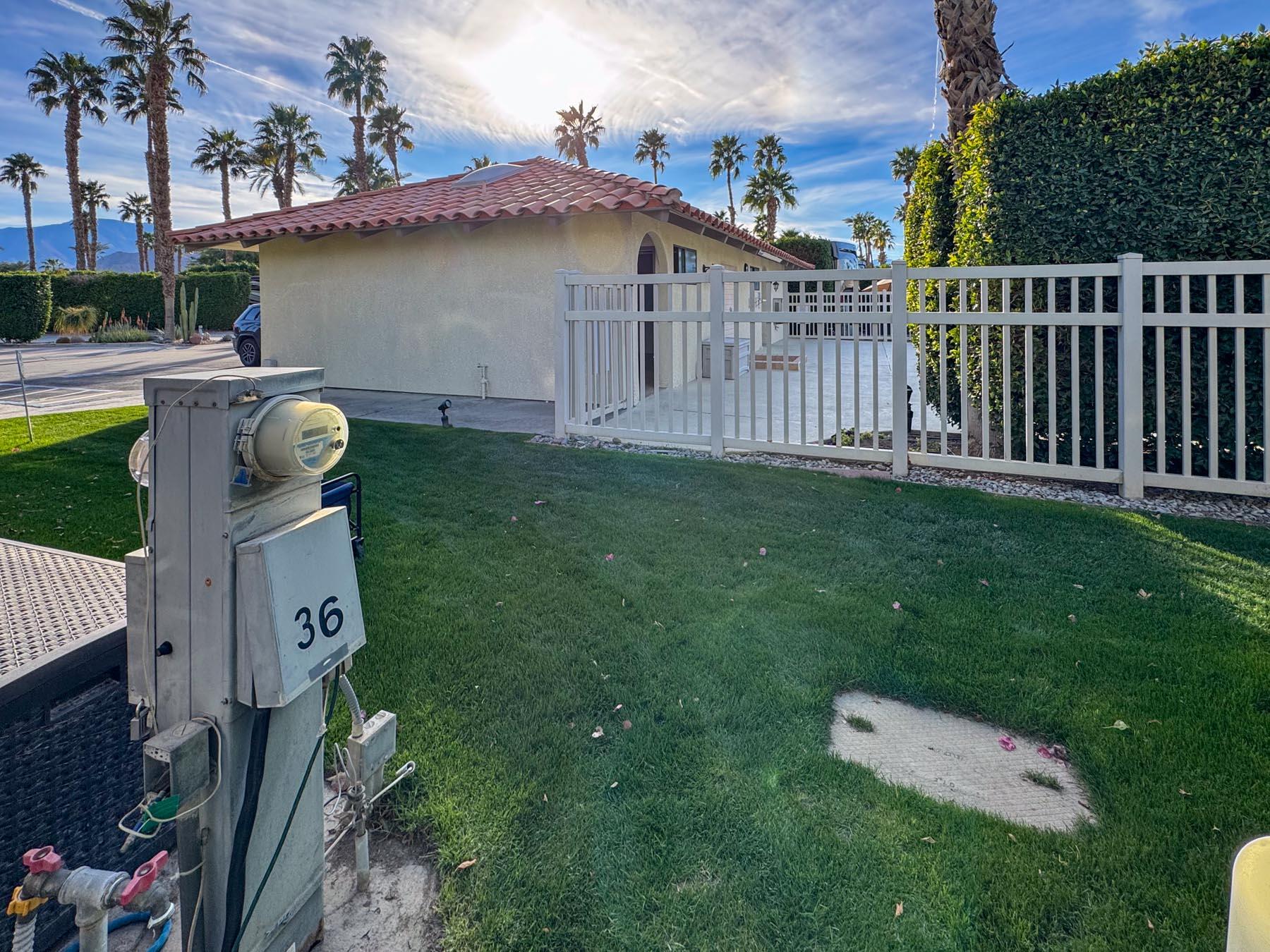80394 Ave 48, Unit 36 Indio, CA 92201 - Photo 5 of 17 a backyard of a house with table and chairs