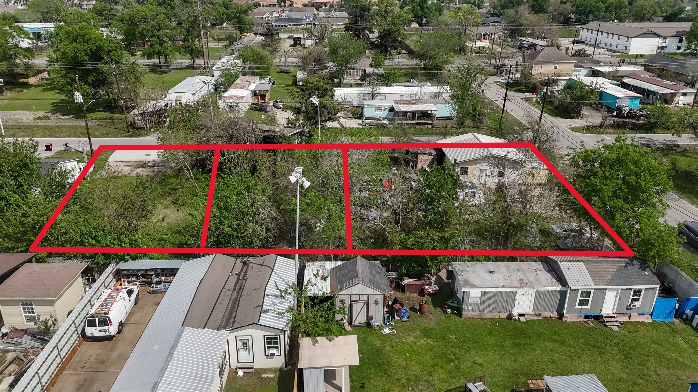 14340 Force Street Houston, TX 77015 - Photo 4 of 10 a view of swimming pool and red chairs under an umbrella