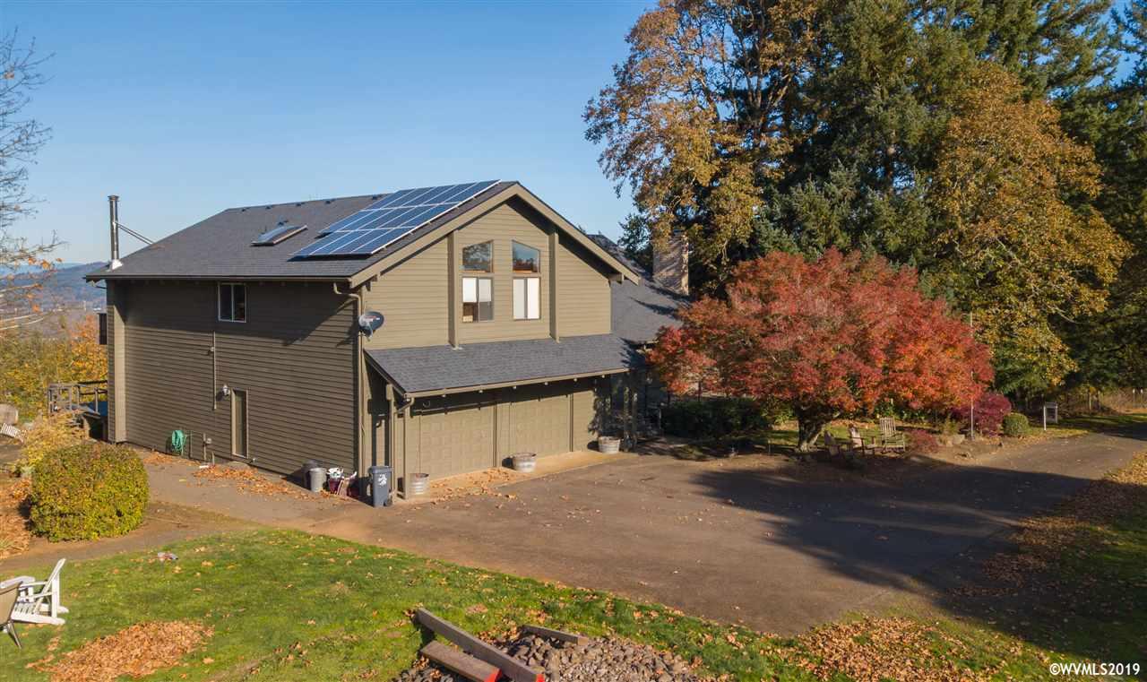 4158 Homestead Road South Salem, OR 97302 - Photo 38 of 39 a front view of a house with a yard and garage