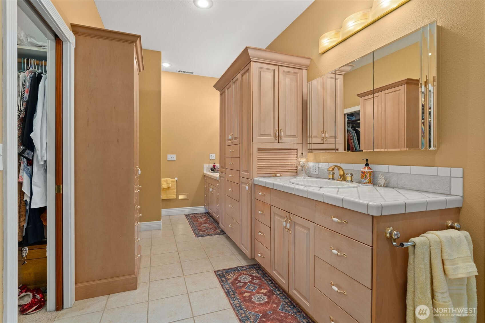 2599 Seminary Hill Road Centralia, WA 98531 - Photo 12 of 40 a bathroom with a granite countertop sink a mirror and a shower