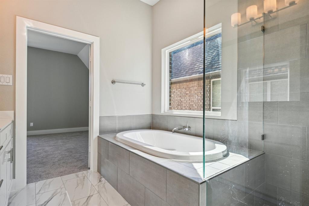 1711 Paytyn Drive Allen, TX 75013 - Photo 21 of 37 Bathroom with vanity and separate shower and tub