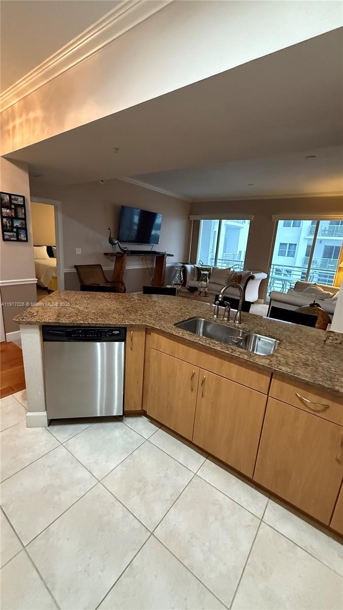 1830 Radius Drive, Unit 1105 Hollywood, FL 33020 - Photo 17 of 32 a large kitchen with granite countertop a sink and a stove