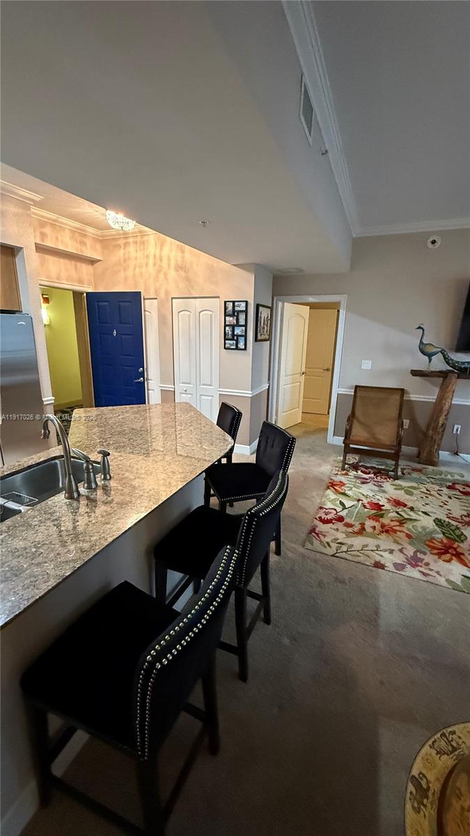 1830 Radius Drive, Unit 1105 Hollywood, FL 33020 - Photo 20 of 32 a living room with couch and a table