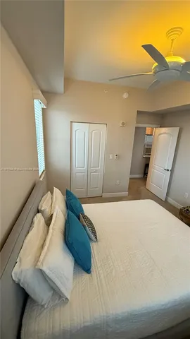 a bedroom with a large bed and a couch