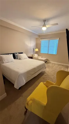 a bedroom with a bed and a night stand