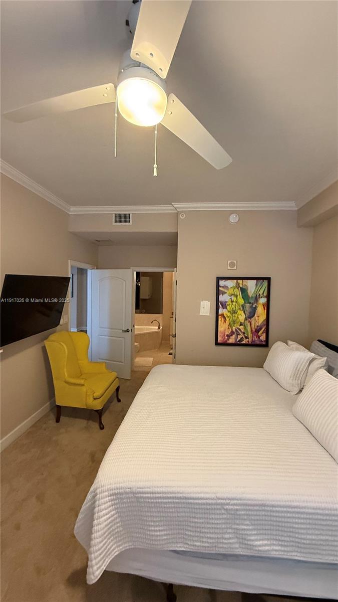 1830 Radius Drive, Unit 1105 Hollywood, FL 33020 - Photo 27 of 32 a bedroom with a bed and a television