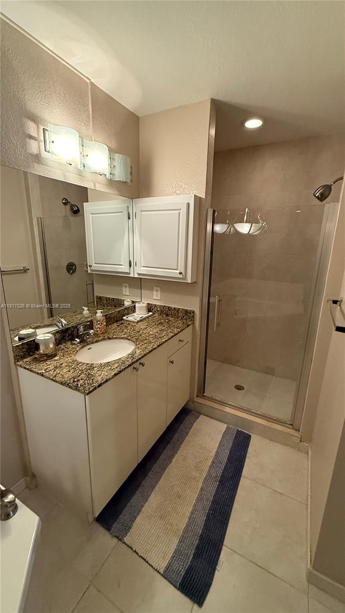 1830 Radius Drive, Unit 1105 Hollywood, FL 33020 - Photo 28 of 32 a bathroom with a sink a toilet and shower