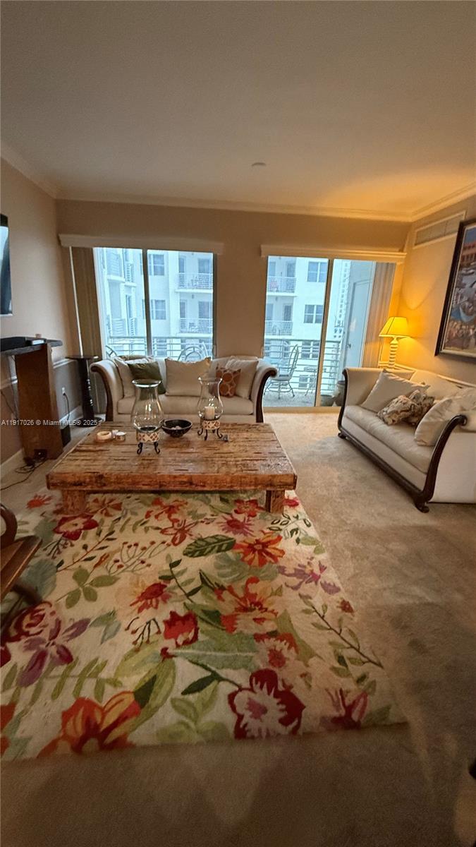 1830 Radius Drive, Unit 1105 Hollywood, FL 33020 - Photo 7 of 32 a living room with furniture window and a flat screen tv