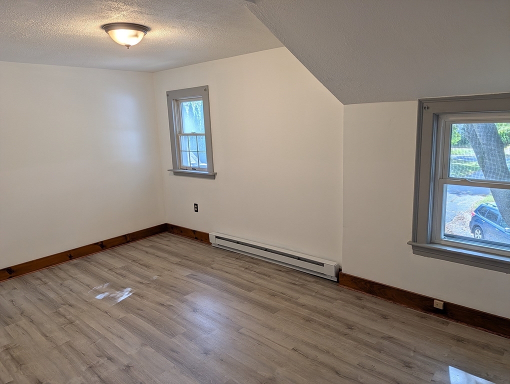 25 Graves Street Deerfield, MA 01373 - Photo 17 of 29 a view of an empty room with wooden floor and a window