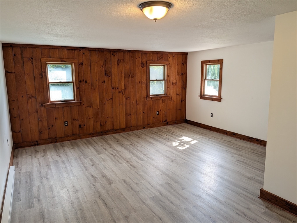 25 Graves Street Deerfield, MA 01373 - Photo 19 of 29 an empty room with wooden floor and windows