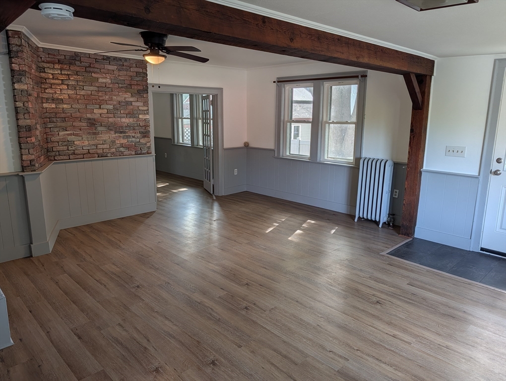 25 Graves Street Deerfield, MA 01373 - Photo 4 of 29 an empty room with wooden floor and windows