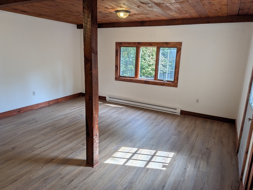 25 Graves Street Deerfield, MA 01373 - Photo 10 of 29 an empty room with wooden floor and windows