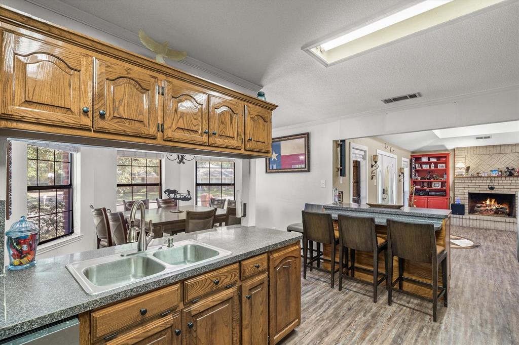 163 Granada Square Canton, TX 75103 - Photo 15 of 35 a kitchen with a sink and chairs