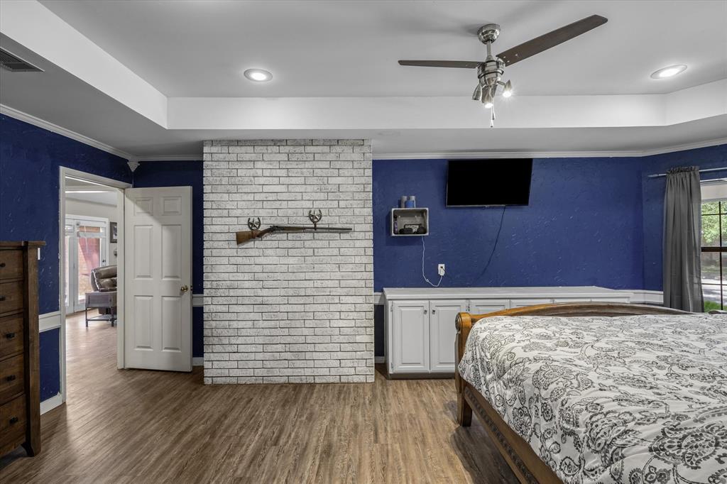 163 Granada Square Canton, TX 75103 - Photo 22 of 35 a bedroom with a bed and a flat screen tv