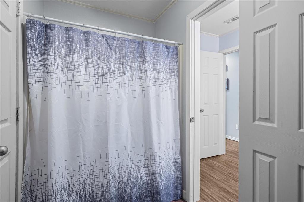 163 Granada Square Canton, TX 75103 - Photo 27 of 35 a view of a bathroom with shower curtain