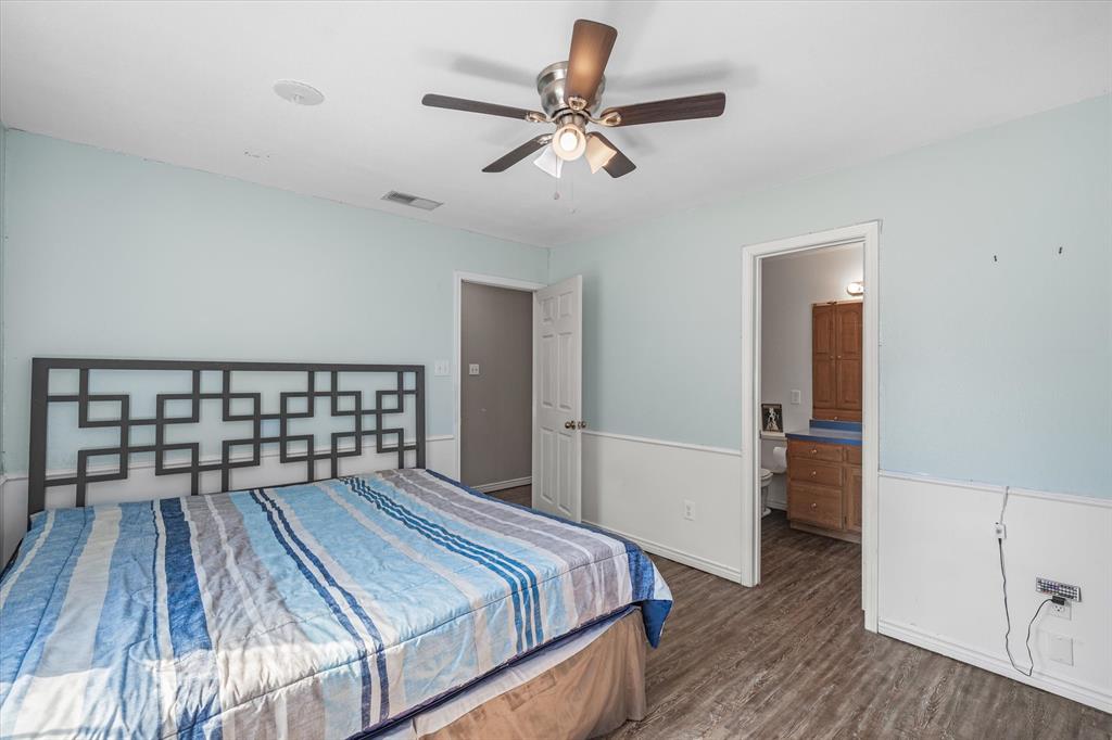 163 Granada Square Canton, TX 75103 - Photo 32 of 35 a bedroom with a bed and a ceiling fan