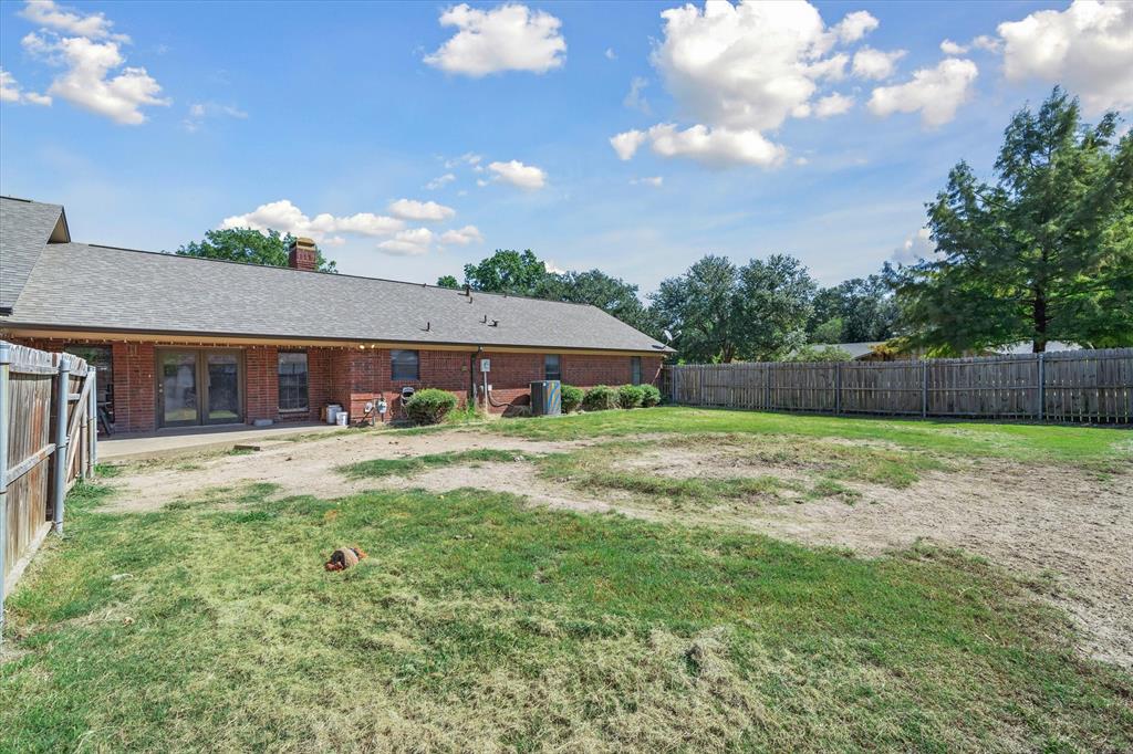 163 Granada Square Canton, TX 75103 - Photo 35 of 35 a front view of house with yard nad seating space