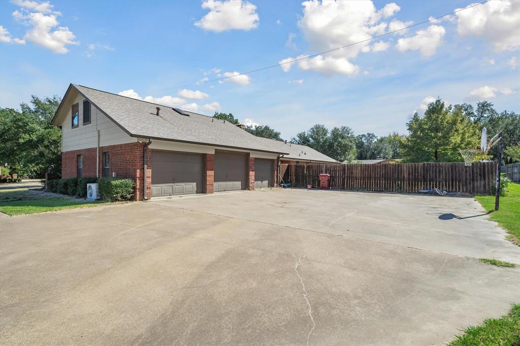 163 Granada Square Canton, TX 75103 - Photo 4 of 35 a view of house with backyard and a garden