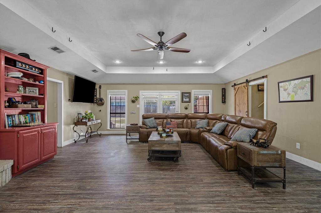 163 Granada Square Canton, TX 75103 - Photo 7 of 35 a living room with furniture and a flat screen tv