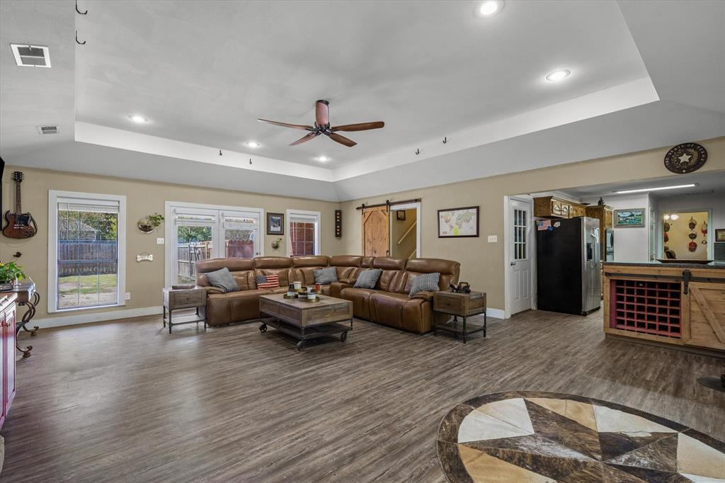 163 Granada Square Canton, TX 75103 - Photo 8 of 35 a living room with furniture and wooden floor