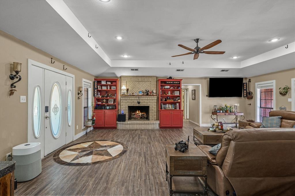 163 Granada Square Canton, TX 75103 - Photo 9 of 35 a living room with furniture and a flat screen tv