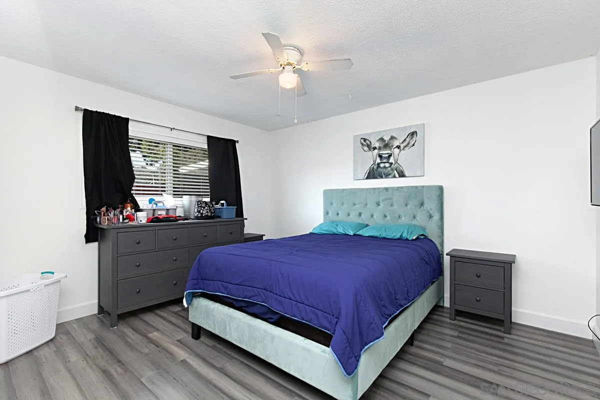 612 Broadview Street Spring Valley, CA 91977 - Photo 8 of 15 a bedroom with a bed and a dresser