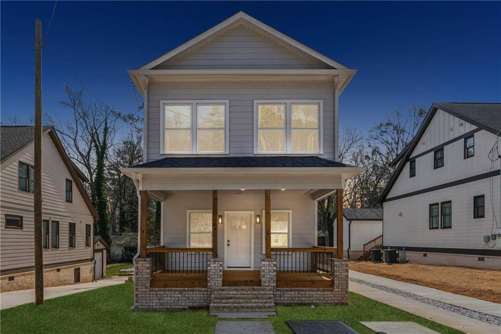 240 Mount Zion Road Hapeville, GA 30354 - Photo 1 of 1 a front view of a house with a yard