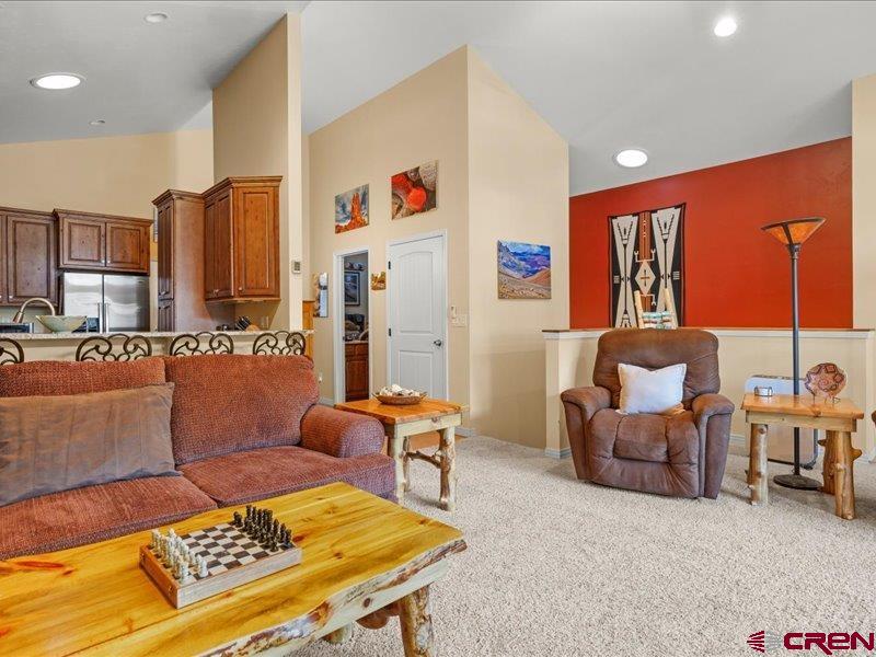 1271 Main Street Ouray, CO 81427 - Photo 12 of 45 a living room with furniture a large window and kitchen view