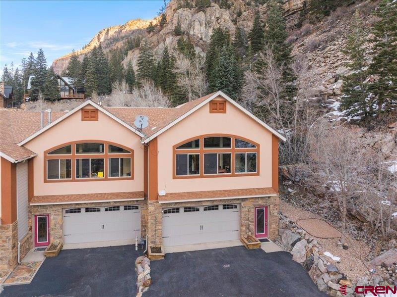 1271 Main Street Ouray, CO 81427 - Photo 2 of 45 a front view of a house with a yard
