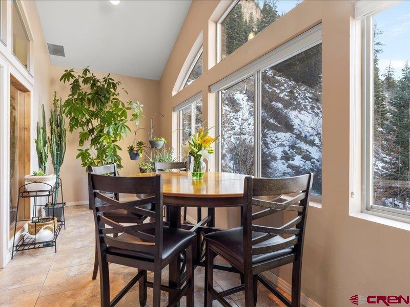 1271 Main Street Ouray, CO 81427 - Photo 25 of 45 a view of a dining room with furniture window and outside view
