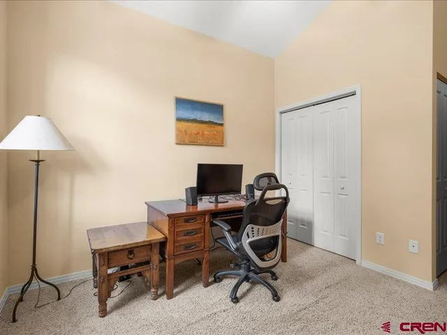 a view of a workspace with furniture