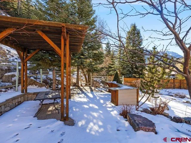 a view of a backyard of the house