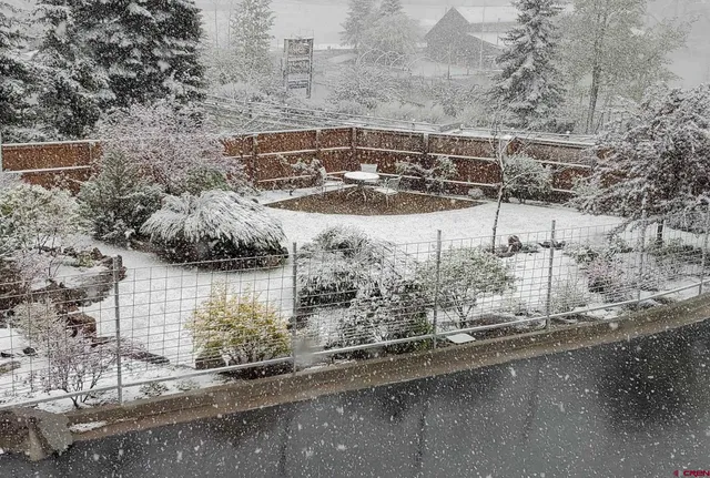 a view of a lake with a house in the background