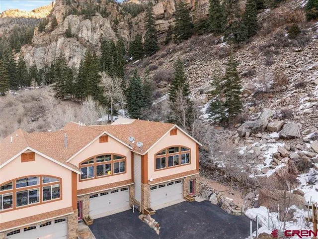 a aerial view of a house with a yard
