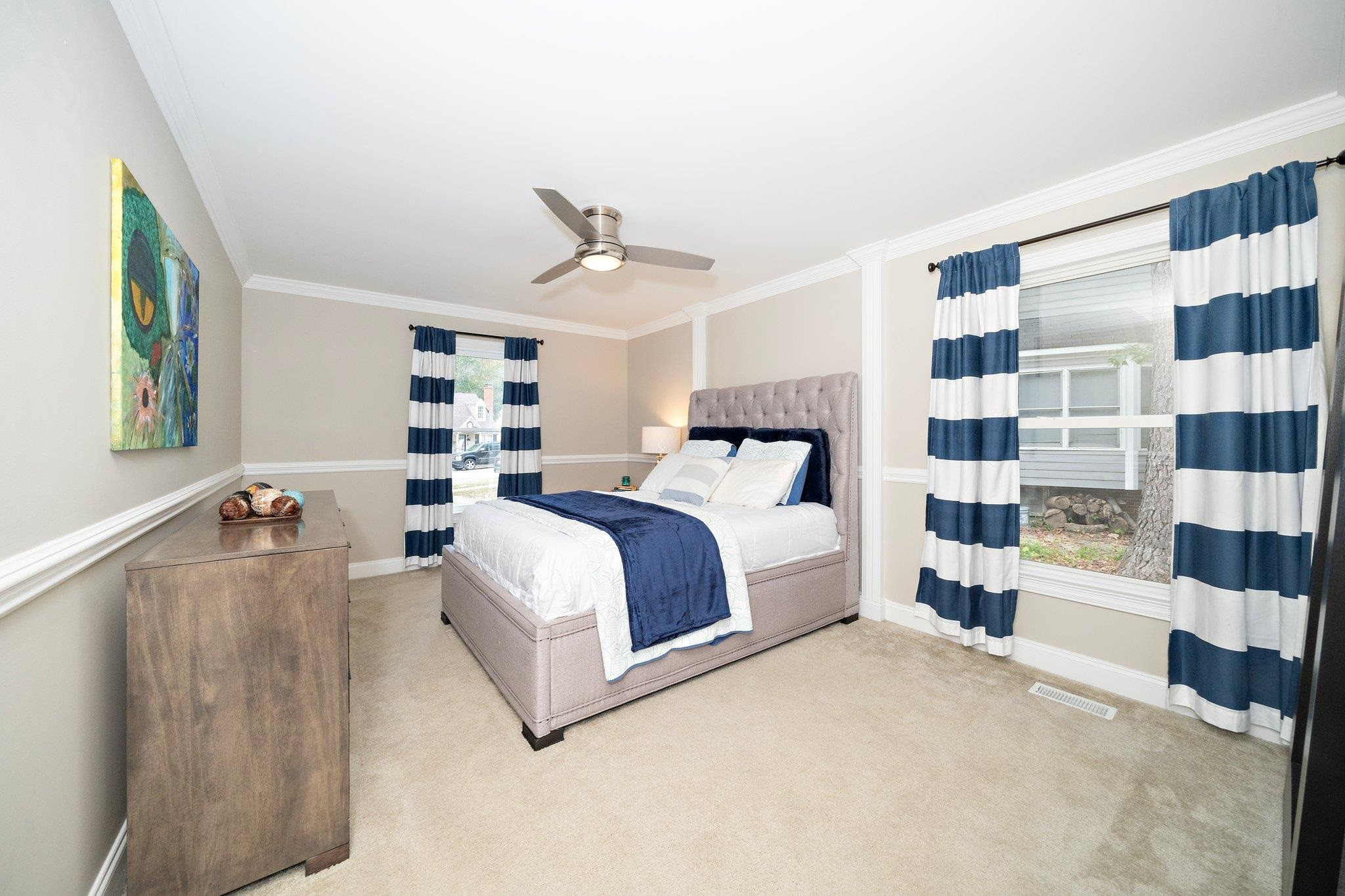 4400 Liverpool Lane Raleigh, NC 27604 - Photo 12 of 34 a bedroom with a bed and walk in closet