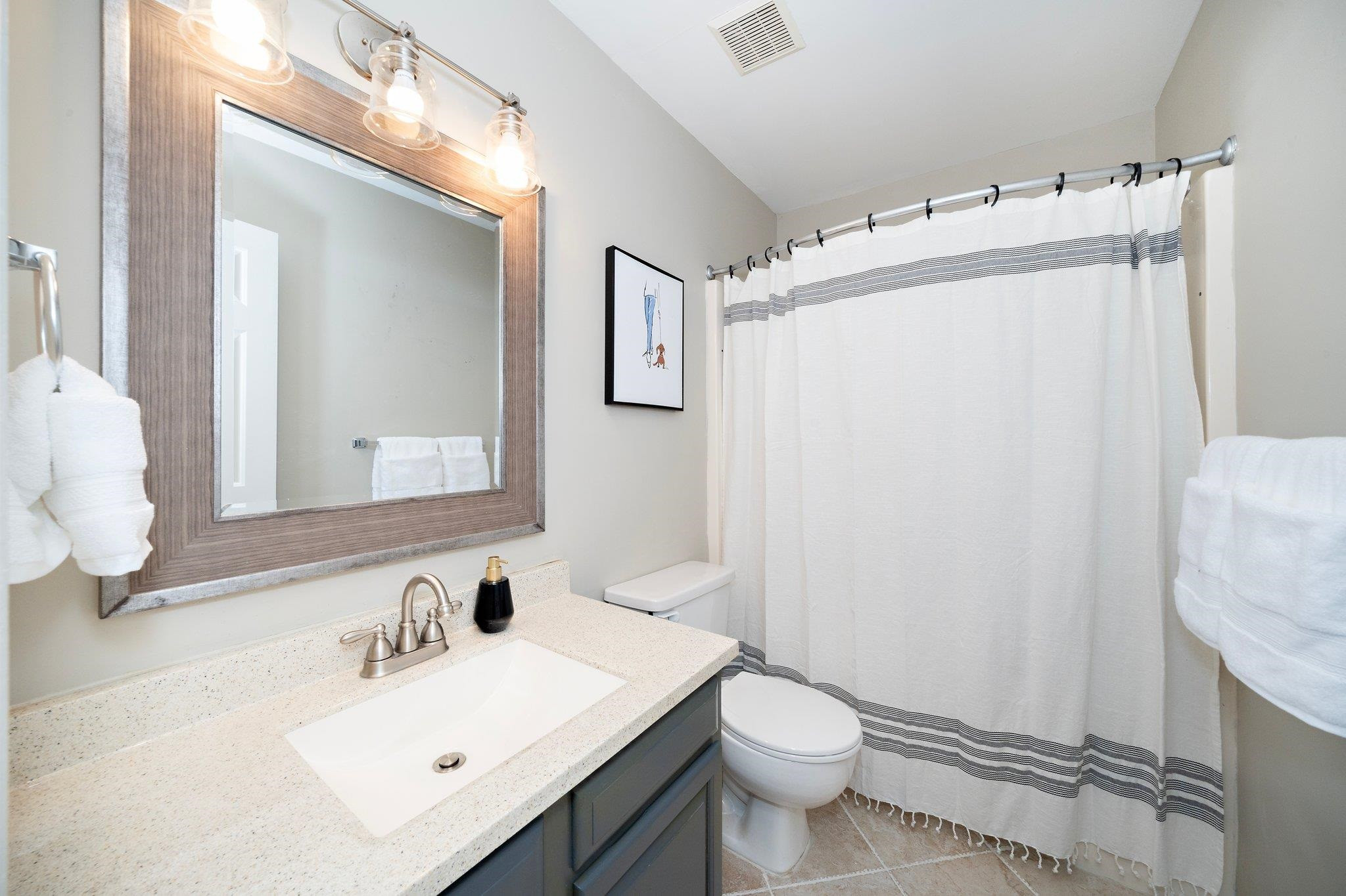 4400 Liverpool Lane Raleigh, NC 27604 - Photo 17 of 34 a bathroom with a sink toilet and mirror