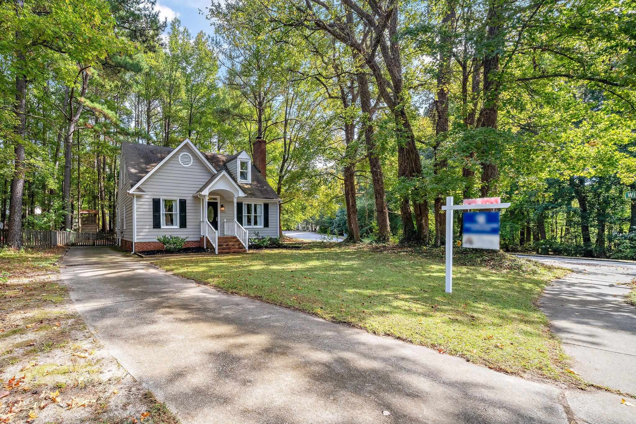 4400 Liverpool Lane Raleigh, NC 27604 - Photo 4 of 34 a front view of a house with a yard and trees